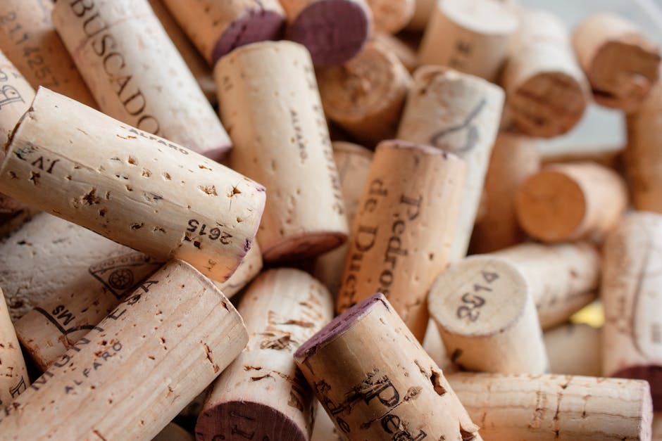 A detailed close-up of various wine corks with visible impressions and textures.