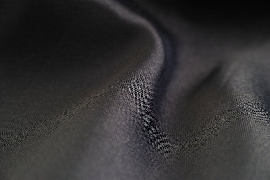Soft and smooth texture of velvet fabric in a close-up shot, highlighting its luxurious detail.