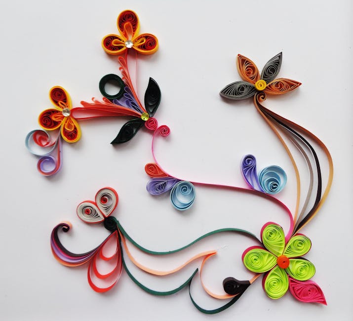 Colorful paper quilling floral design creating a vibrant decorative pattern.