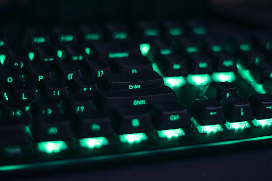 Close-up of a glowing mechanical keyboard with green LED lights perfect for gaming setups.