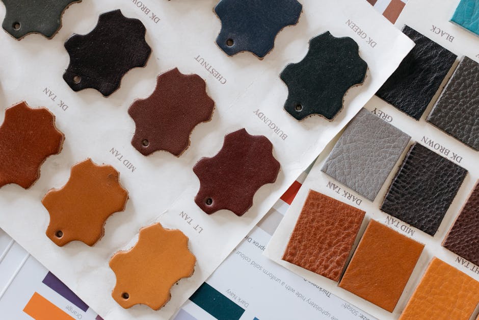 Selection of leather swatches in various colors and textures displayed on paper samples.