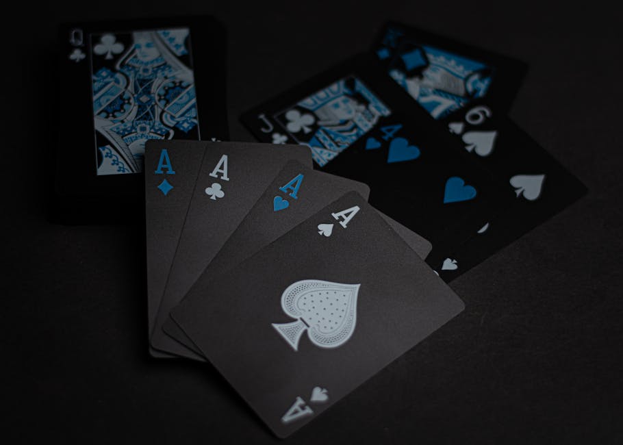 Close-up of aces and other playing cards with a unique dark color scheme.